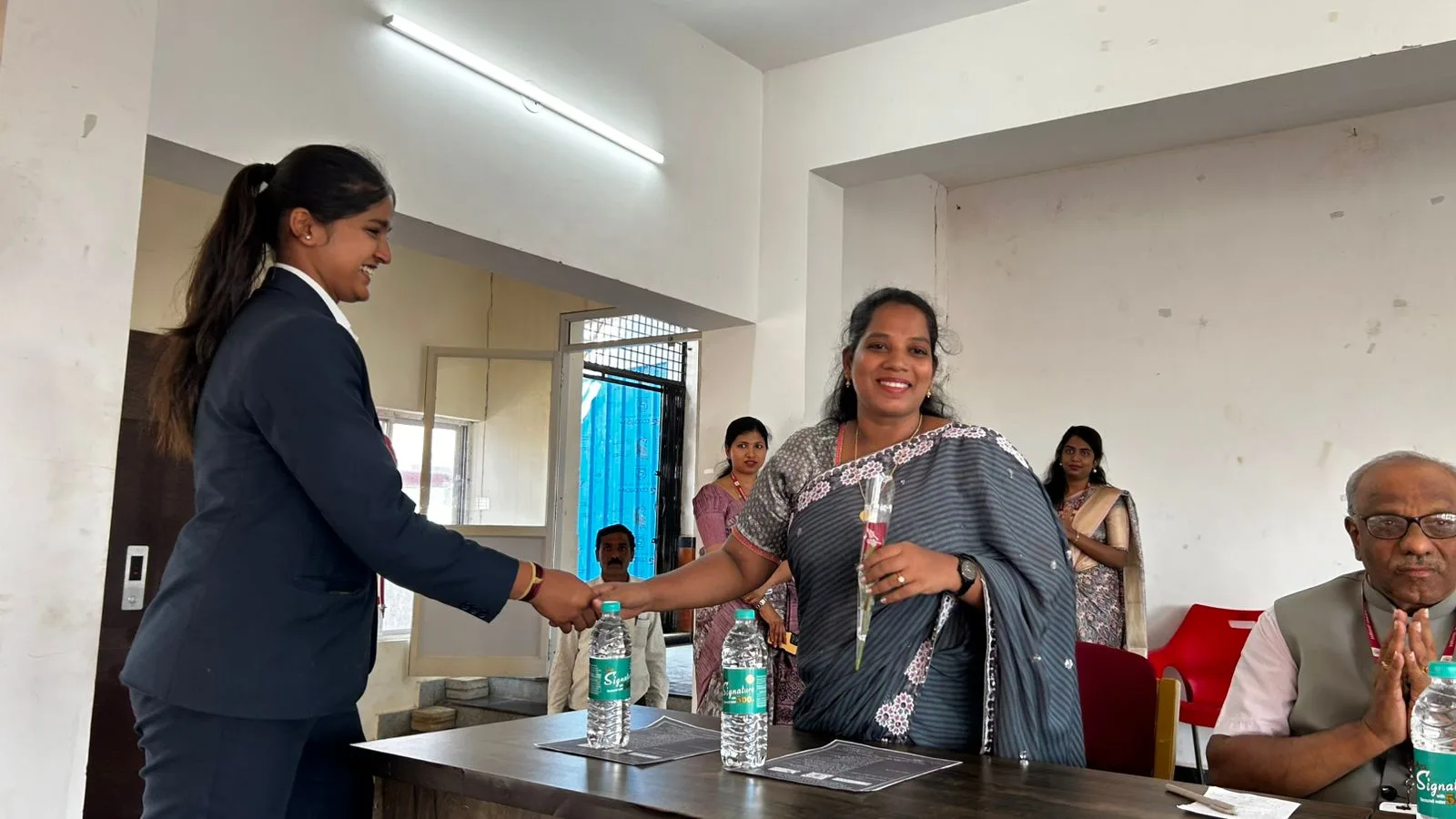 Mrs. Rita Marshall being felicitated by faculty at HRIHE Hassan during the Student Transformation Program